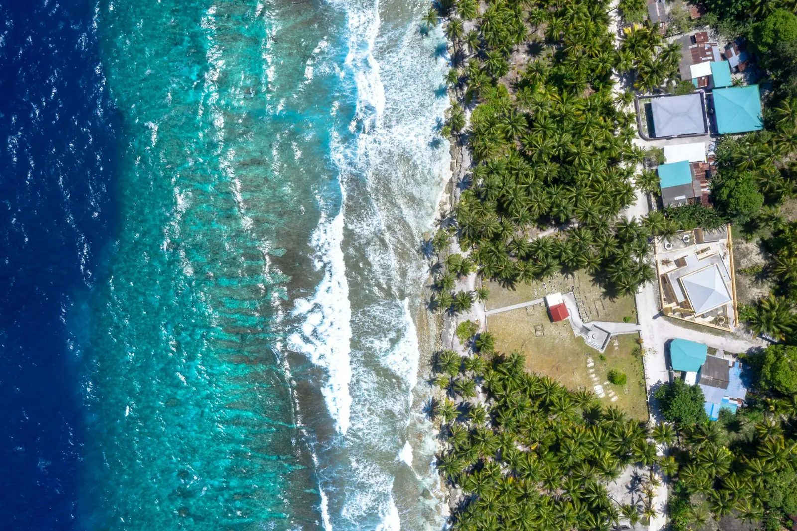 The island’s coast and reef edge from above