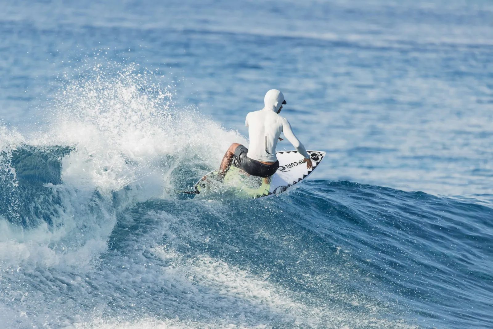 A surfer on a breaking wave