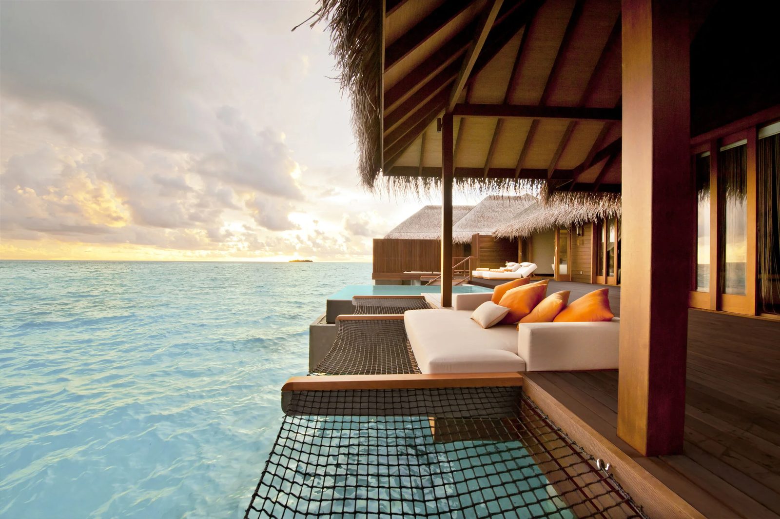 Sunset Family Ocean Suite with Pool · Two bedrooms · over-water sunset